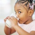 Young girl drinking milk