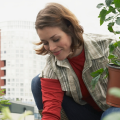 woman planting a container garden