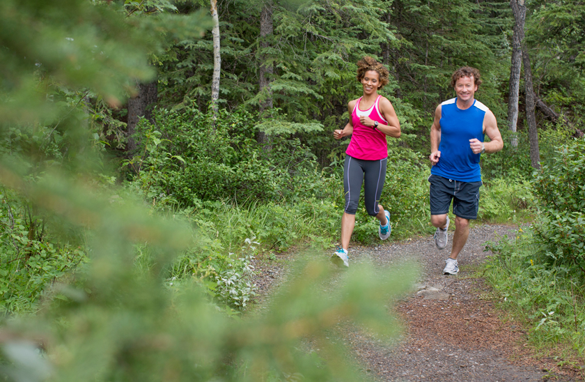 man and woman trail running