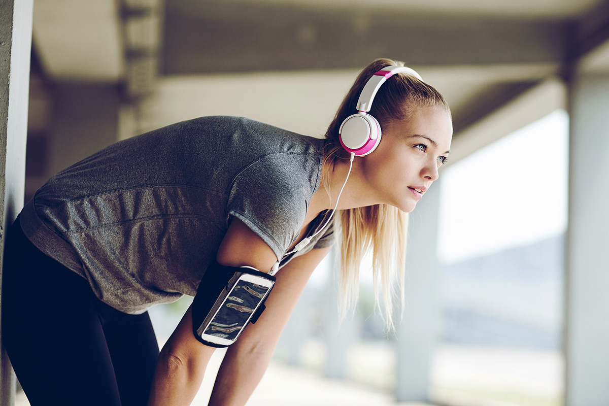 woman listening to music while exercising
