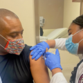 Kevin Woods getting vaccinated.
