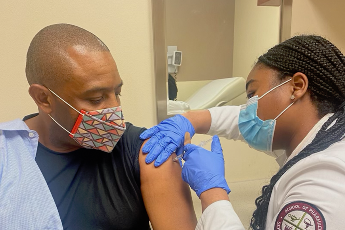 Kevin Woods getting vaccinated.