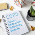 COPD Chronic Obstructive Pulmonary Disease written in notebook on white table