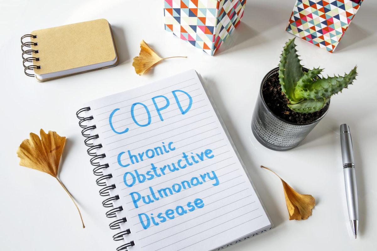 COPD Chronic Obstructive Pulmonary Disease written in notebook on white table