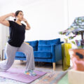 Young Adult Woman Exercising in Her Apartment