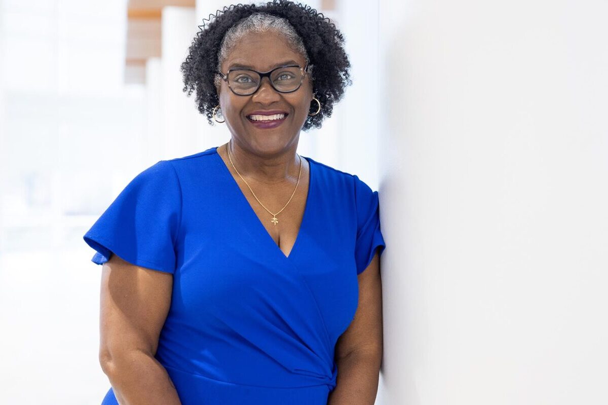 Picture of Angela standing and wearing a blue shirt