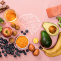 Best foods for brain and memory on pink background. Food for mind and charge of energy. Healthy lifestyle. Top view