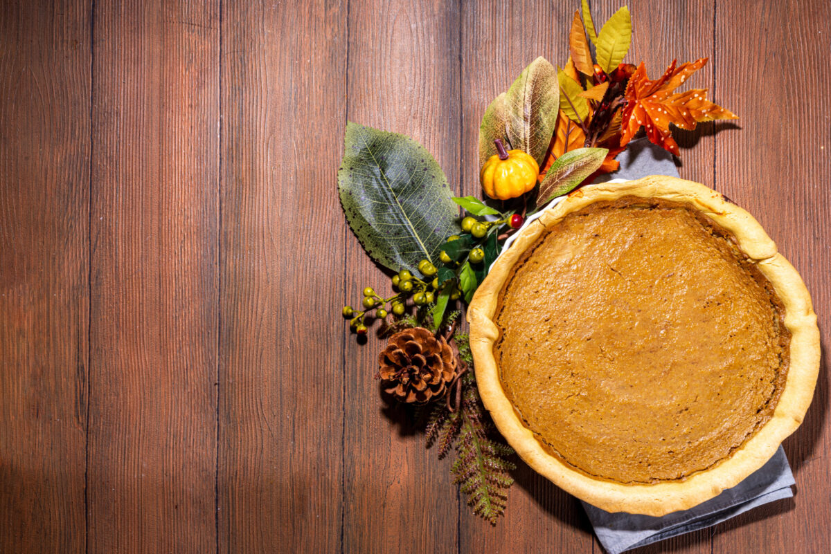 Traditional american holiday pumpkin pie, traditional pastry cake on wooden table
