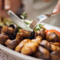 Close up of cutting mushrooms.