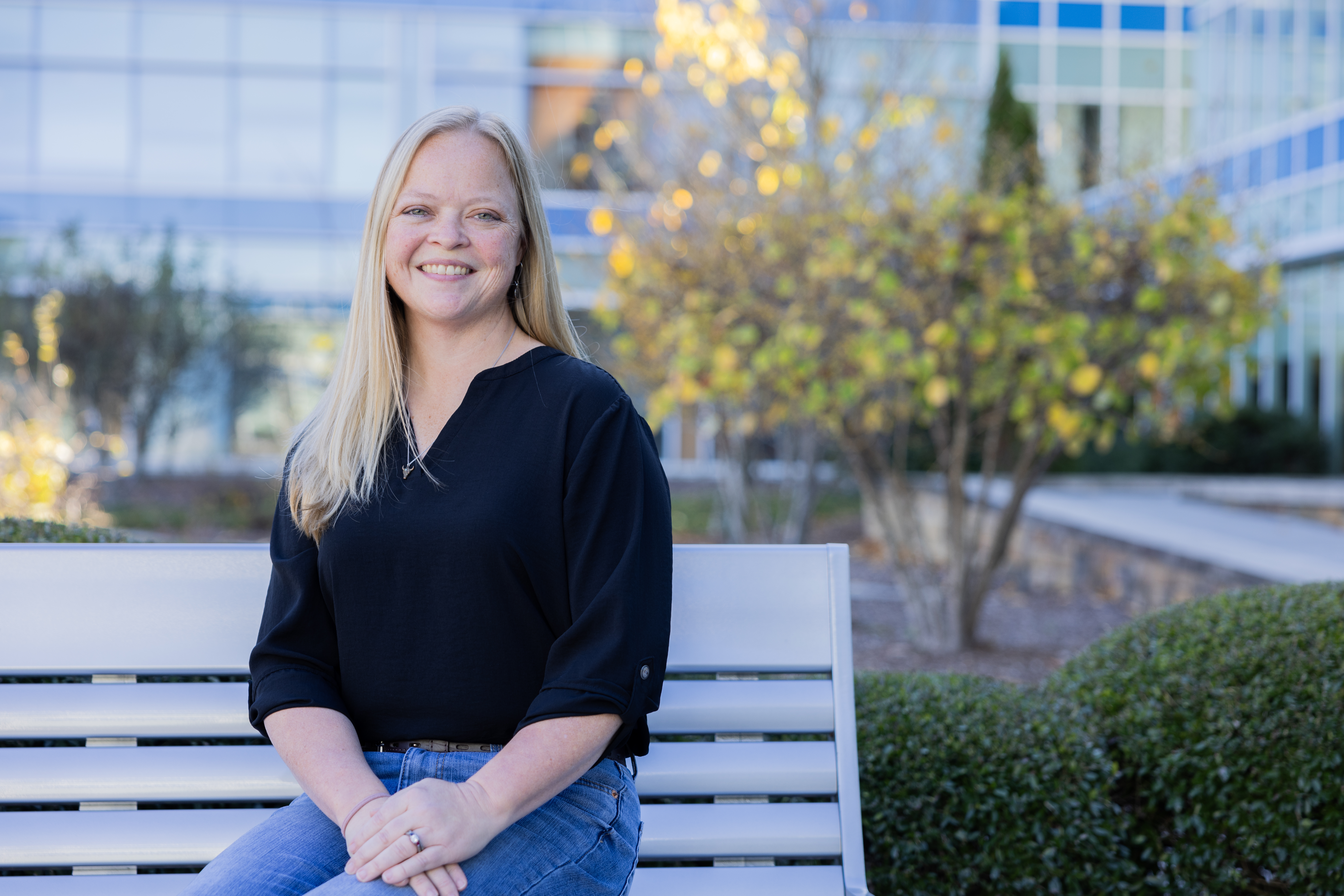 Brandy Smalley sitting outside on a bench.