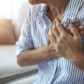 photo of person holding their chest.