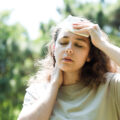Young woman sweating in a warm summer day