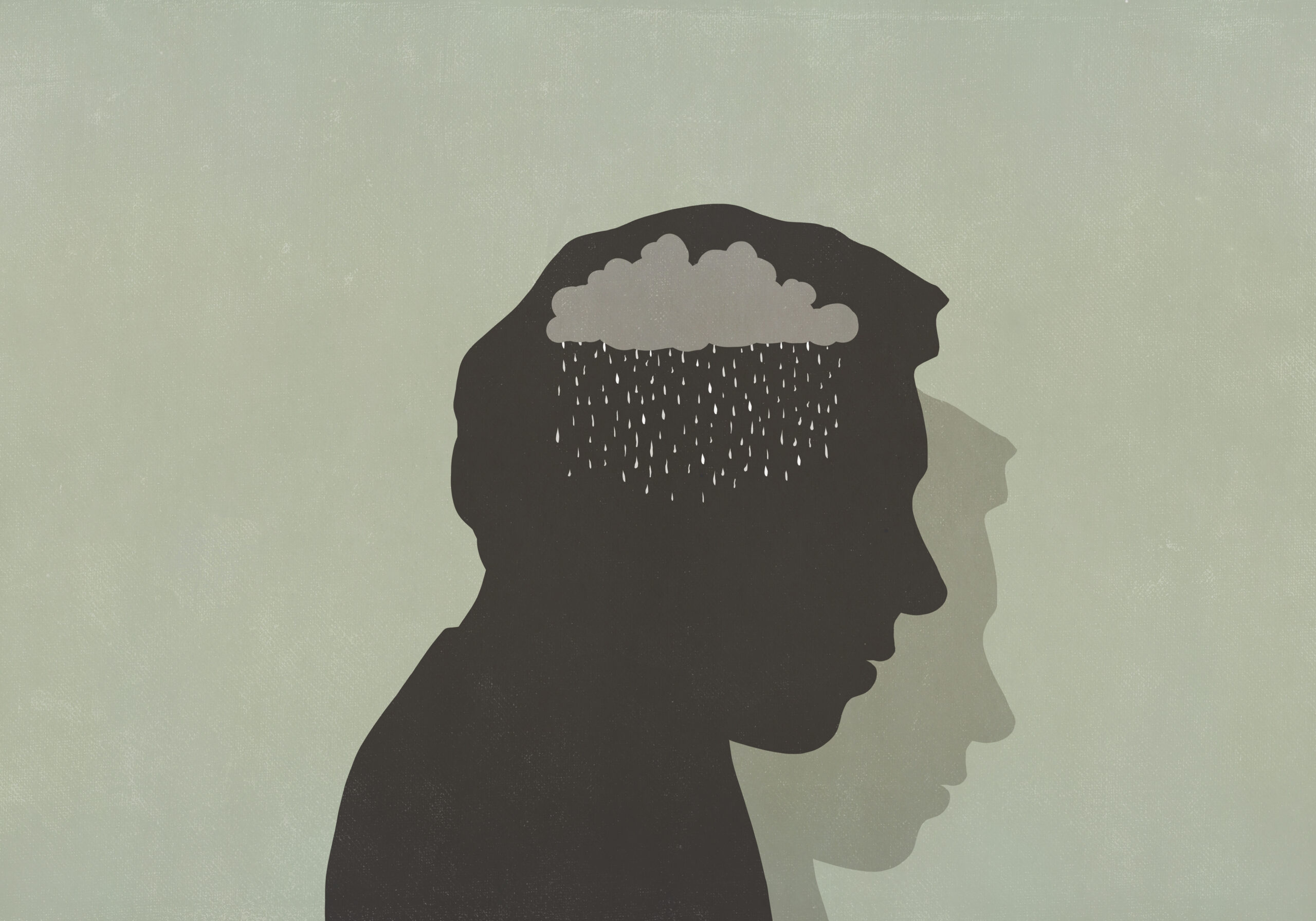Silhouette of sad man with rain cloud in head