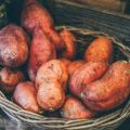 Heap of sweet potatoes in a basket.