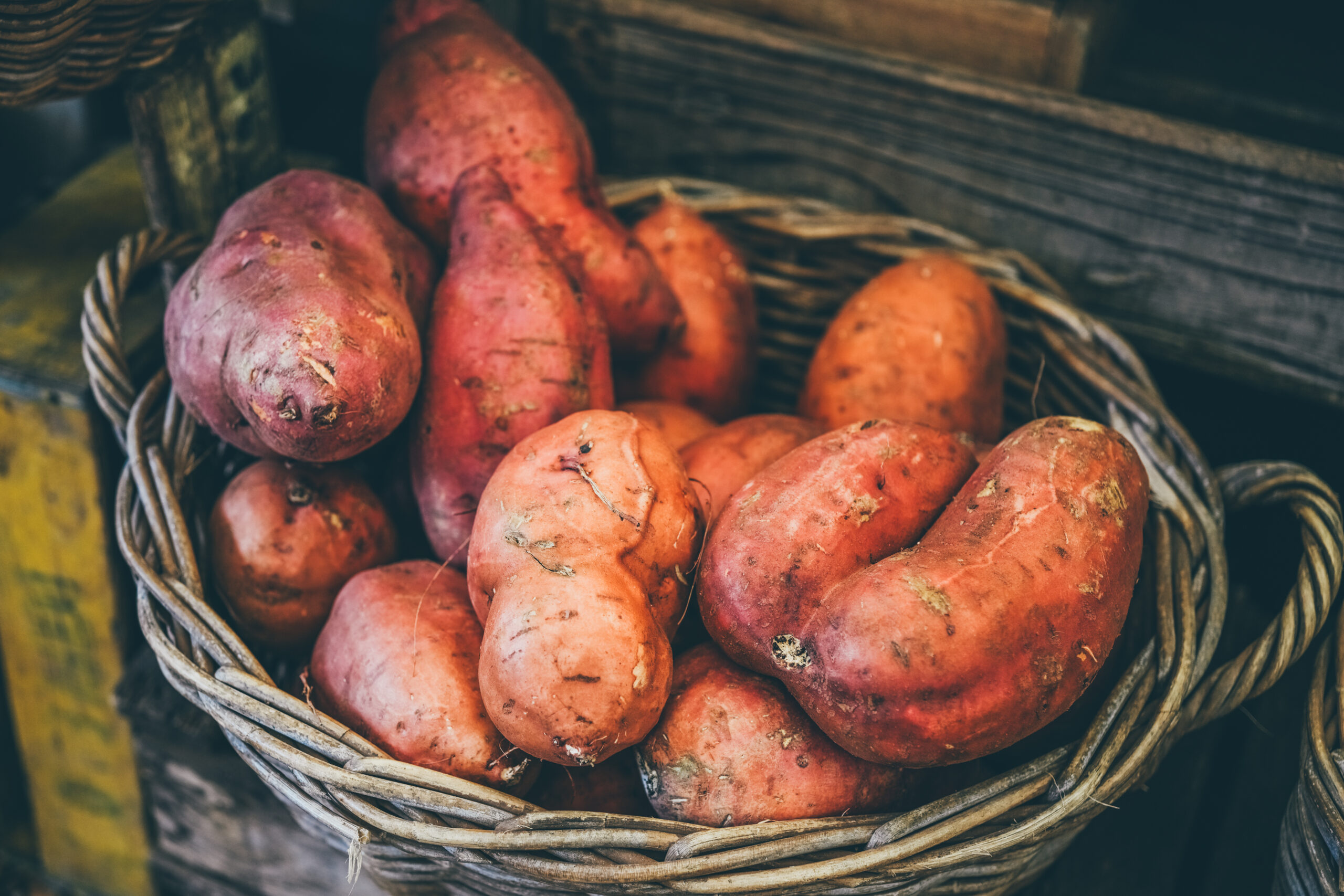 Heap of sweet potatoes in a basket.