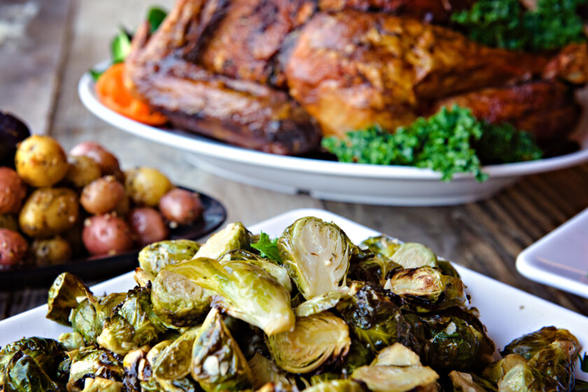 Traditional Turkey Dinner with Brussel Sprouts in Foreground