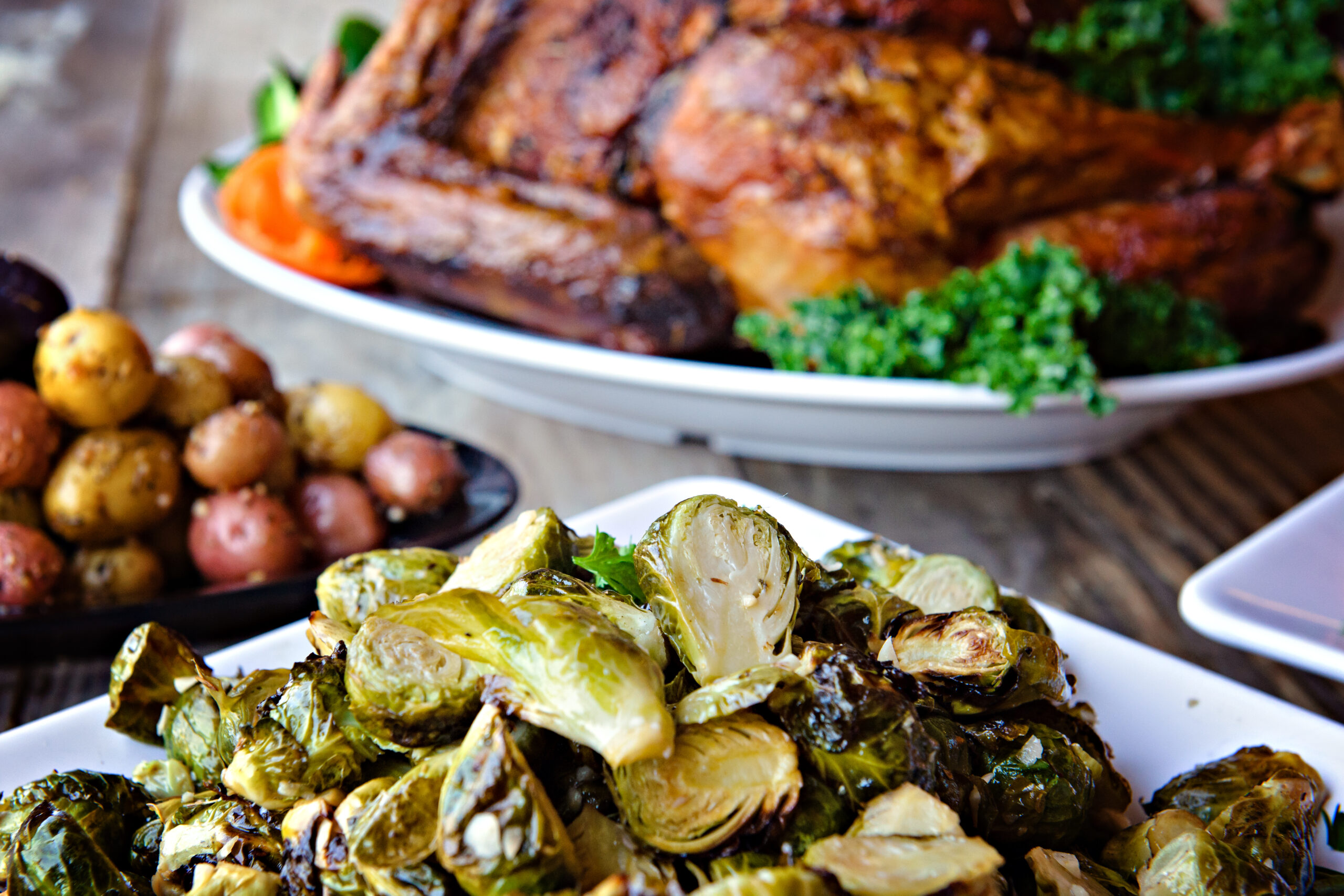 Traditional Turkey Dinner with Brussel Sprouts in Foreground