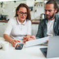 Couple working on taxes together at home