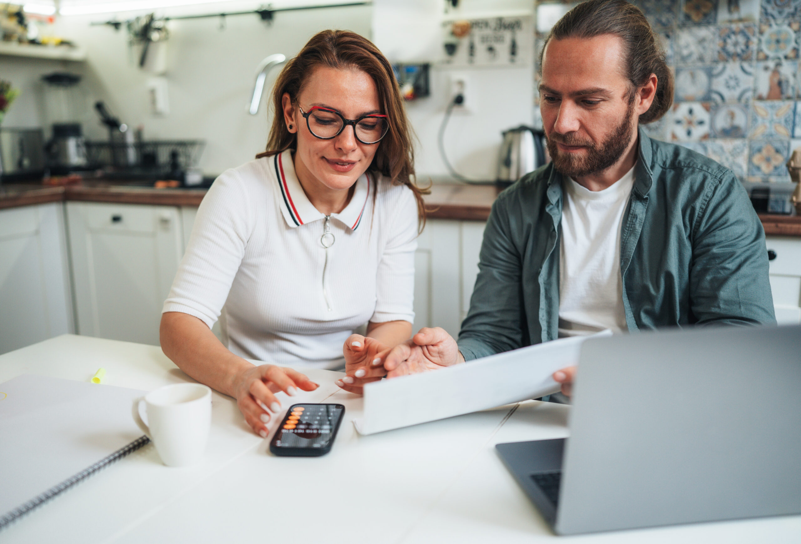 Couple working on taxes together at home