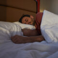 Man peacefully sleeping in the bed