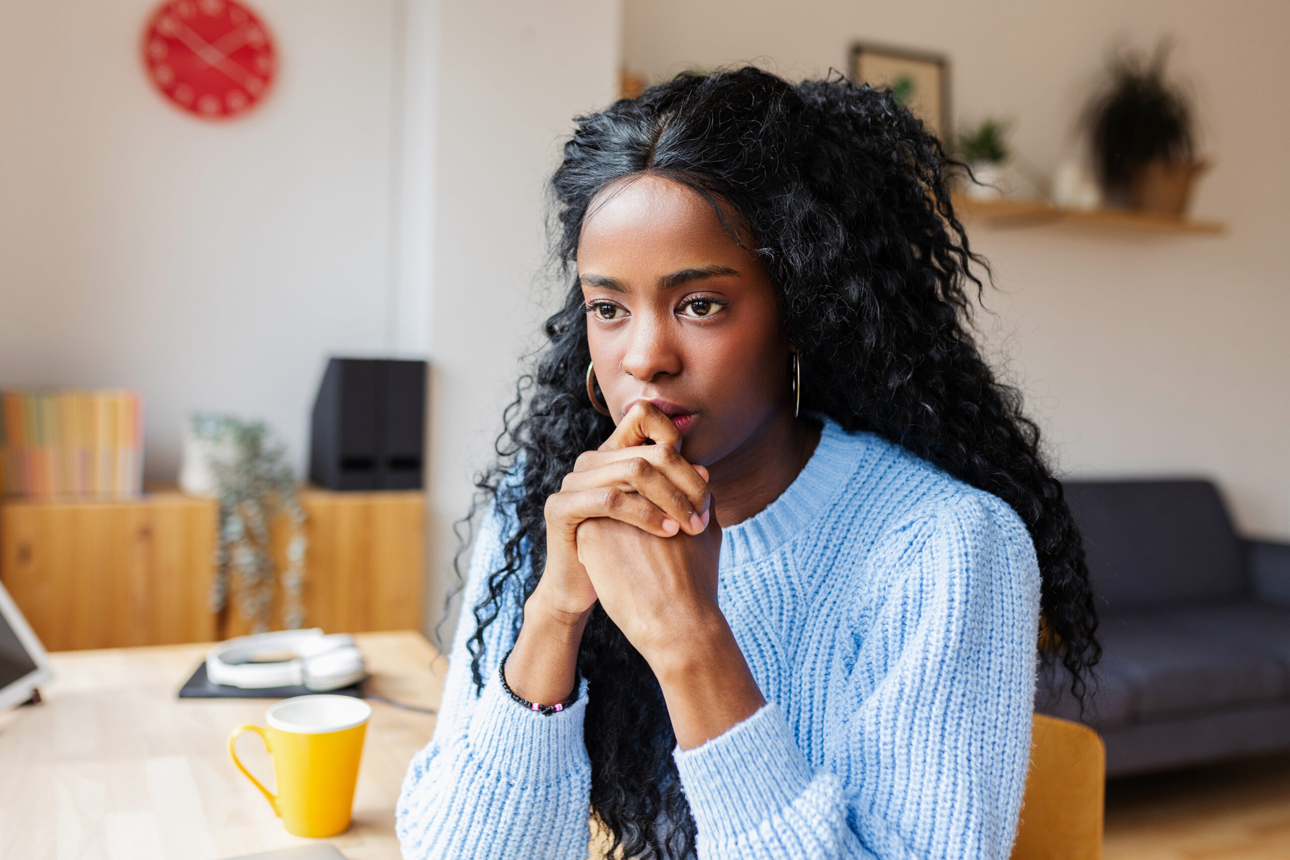 Pensive thoughtful woman with distressed mood thinking and planning.