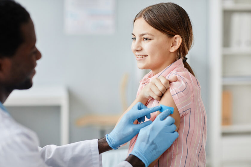 Smiling Girl Getting Vaccinated