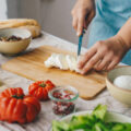 Woman cooking Caprese salad.